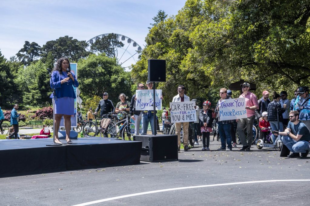 During Mayor London Breed's speech on May 7, 2022, Walk SF supporters held signs in gratitude. Photo by Jim Watkins.