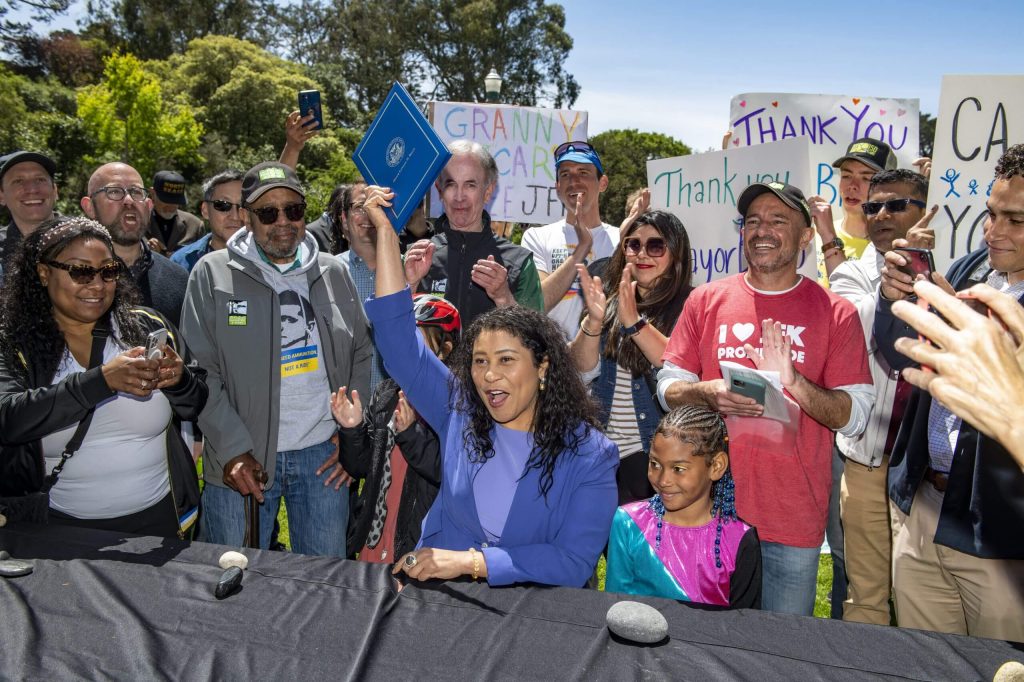 The moment after Mayor London Breed signed legislation making JFK Promenade permanent on May 7, 2022. Photo by Jim Watkins.