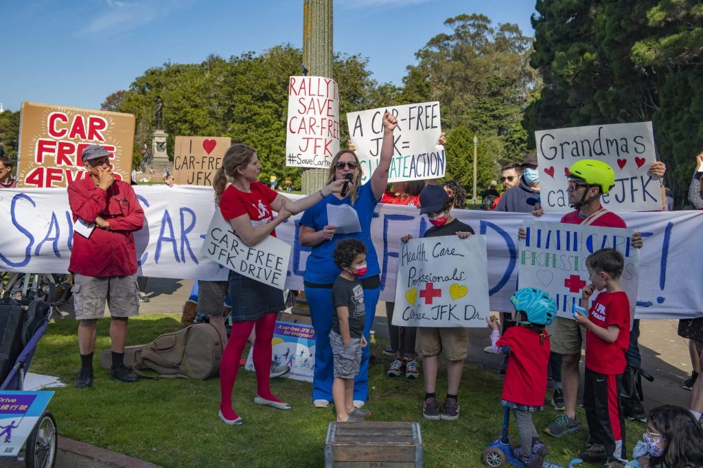 At the February 12 rally, RN Becca Cordes stood with her children and shared why health care professionals believe car-free JFK is critically important. Photo by Jim Watkins.