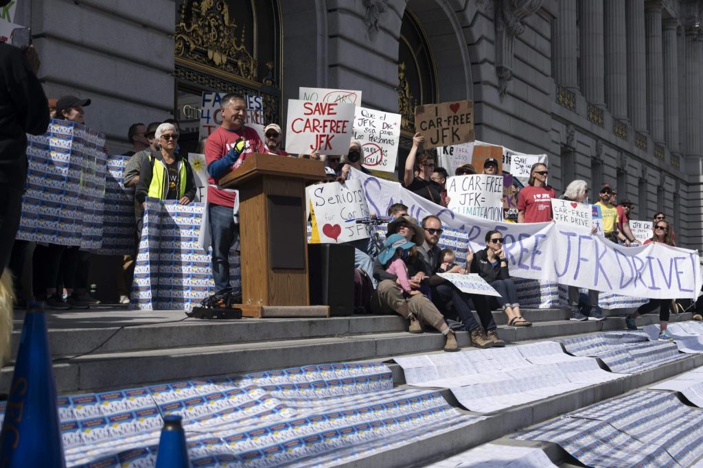 At the March 1 rally, parent Kit Lam spoke about his change of heart with car-free JFK, and how important it became to his family and how he wanted it to stay. Photo by William McLeod.