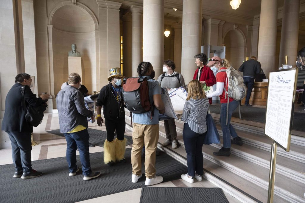 We tried (and failed) to bring the quilts of postcards into City Hall on March 1. Photo by William McLeod.