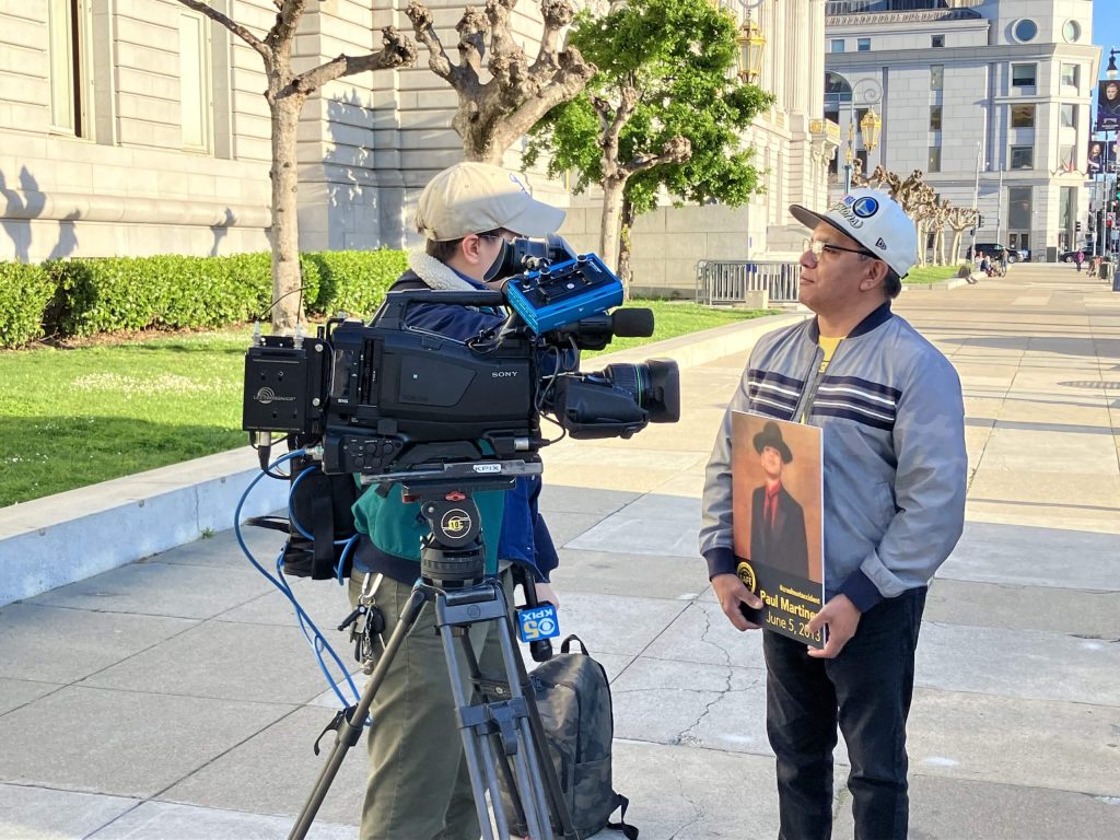 Joe Martinez, a member of Bay Area Families for Safe Streets, speaks in front of San Francisco City Hall. 