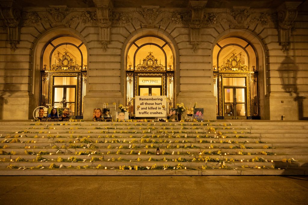 The lights on City Hall glowed yellow for World Day of Remembrance for Road Traffic Victims on November 19, 2023. Nearly 300 people have been killed in traffic crashes since San Francisco adopted Vision Zero in 2014. Photo by William McLeod.