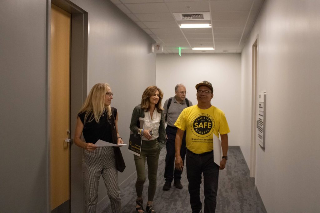 Families for Safe Streets National staff member Aly Geller leads a small group in passing out informational packets to Assemblymembers' offices.