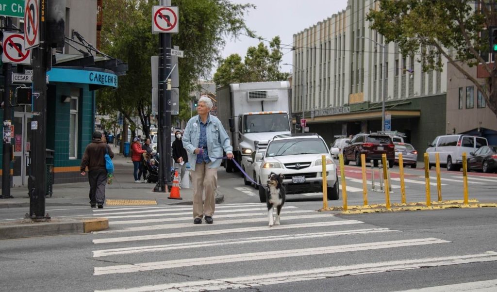 Skip takes Fran for a walk on Cesar Chavez, a street transformed thanks to CC Puede.