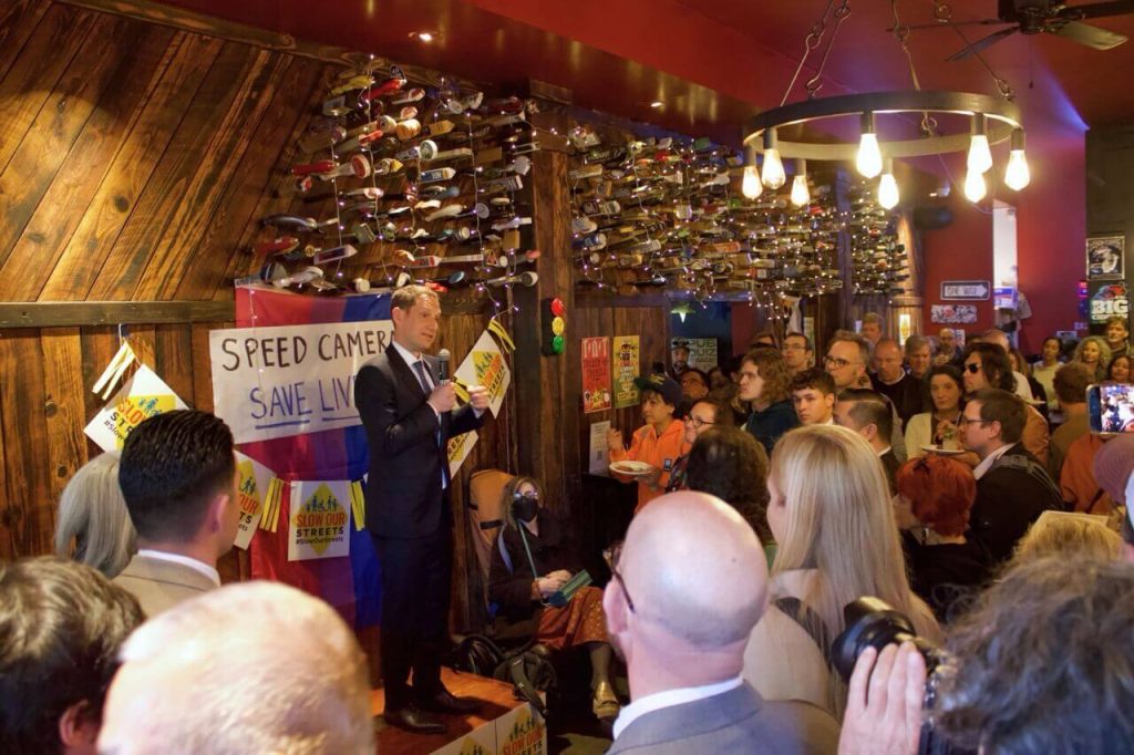 Mayor Daniel Lurie speaking at the speed camera celebration happy hour. Photo by Fiona Yim.