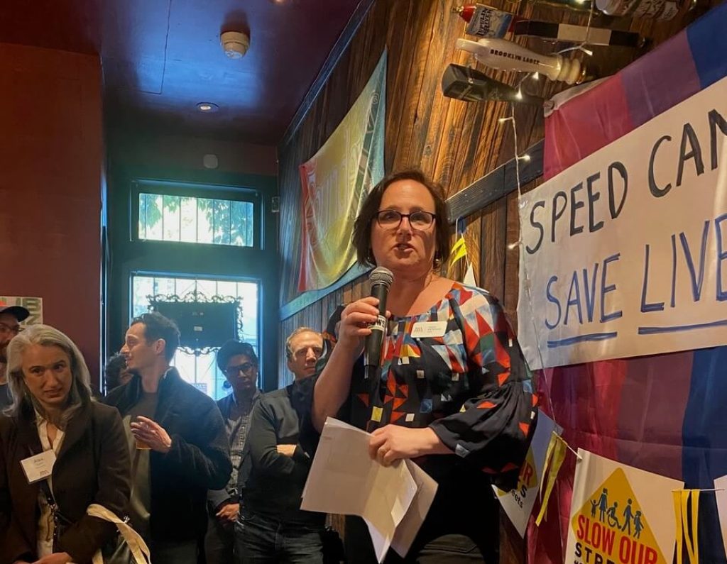 Walk SF Executive Director Jodie Medeiros  speaking at the speed camera celebration happy hour. Photo by Zefania Preza.