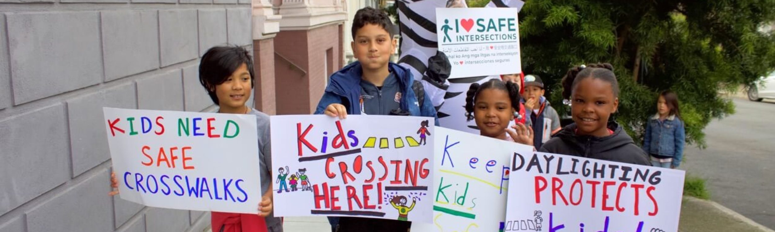 Kids paint curbs and show why ‘daylighting’ matters: we need safer intersections!